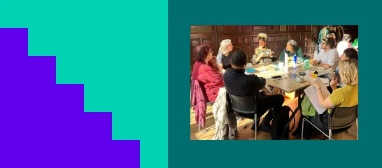 A group of people sitting around a table having a discussion